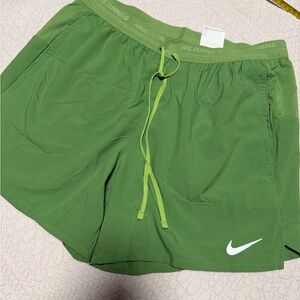 Nike Green Athletic Shorts with White Swoosh